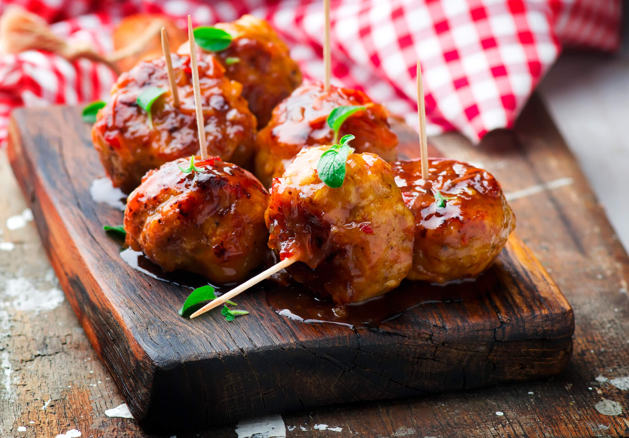 Meatballs on cutting board with toothpicks